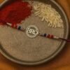 ✨ Silver “Bro” Rakhi with Blue Thread 💙