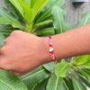 Om Rakhi – Sacred Red Thread with Divine ॐ Charm for Brother